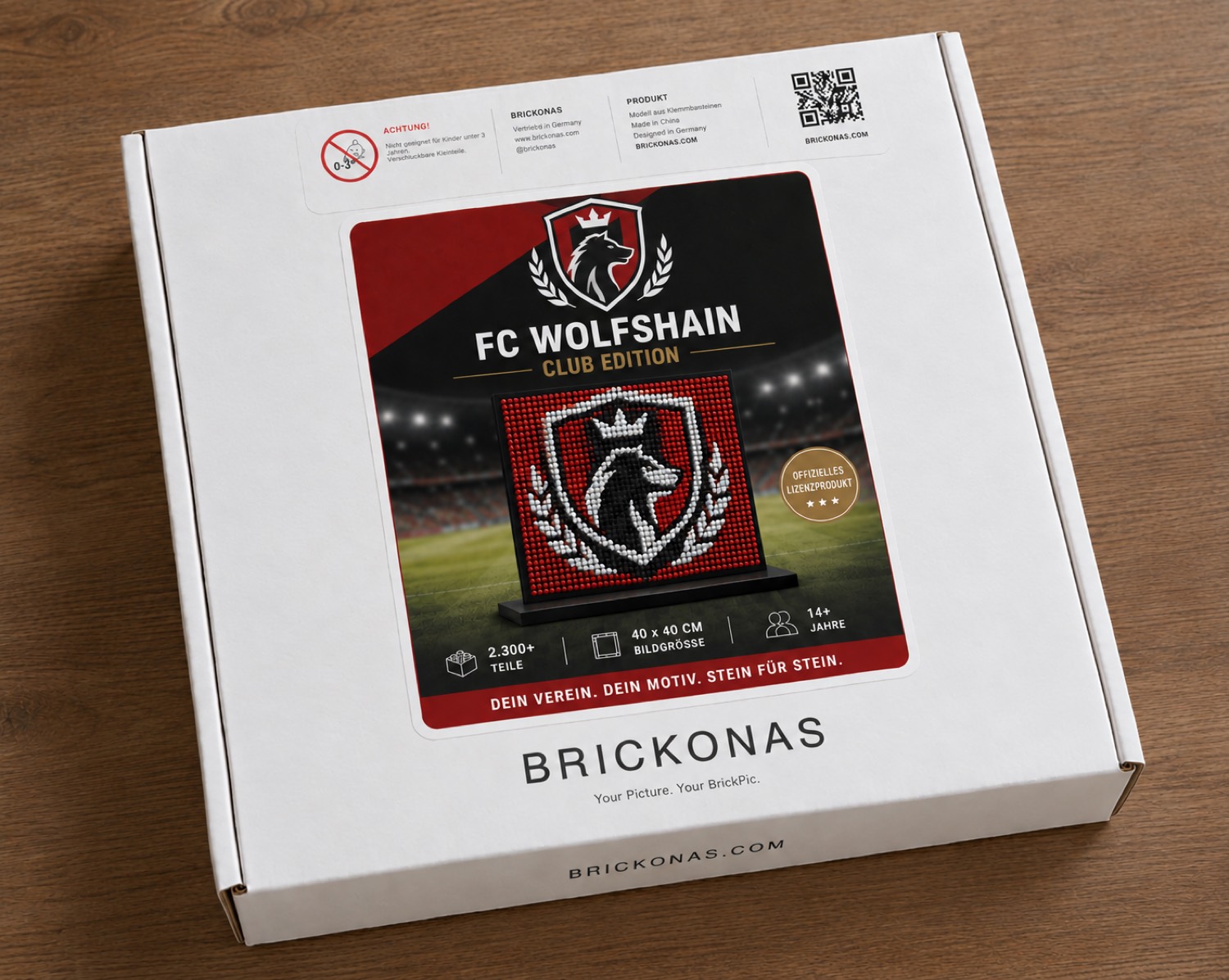 Verpackung einer Club Edition mit Vereinsmotiv auf einem Holztisch